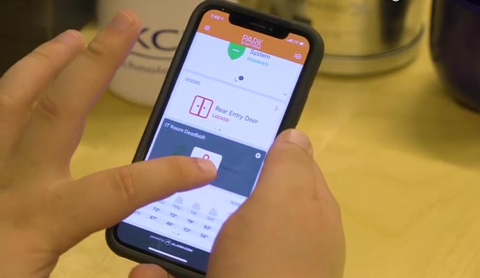A person is using mobile access control system