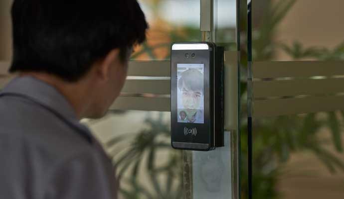 A person is verifying video