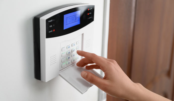 A person using an alarm system alert