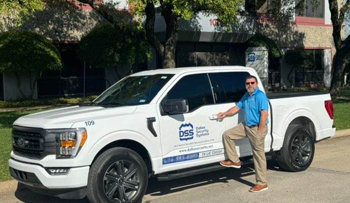 Dallas security crew member with service van