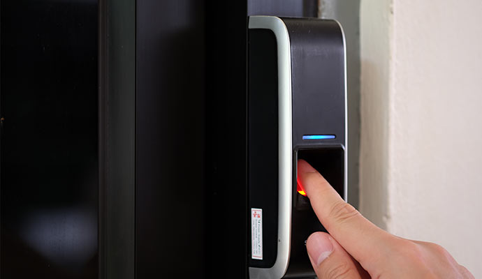Finger on biometric fingerprint scanner