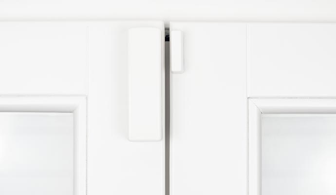 An installed window and door contact system