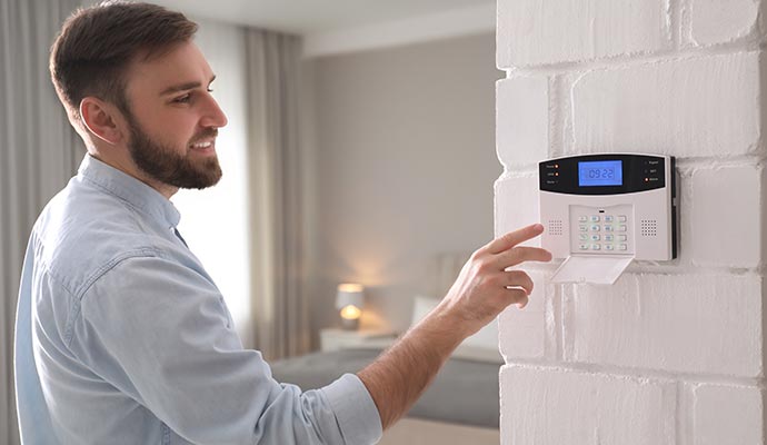 Person using intrusion alarm device