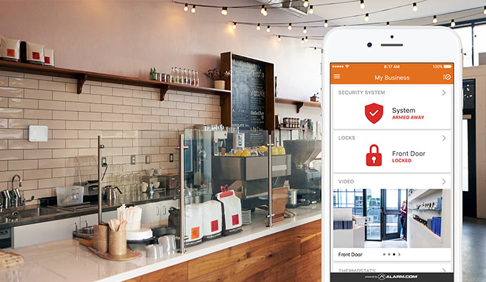 Smartphone displaying real-time security system status and live camera feeds