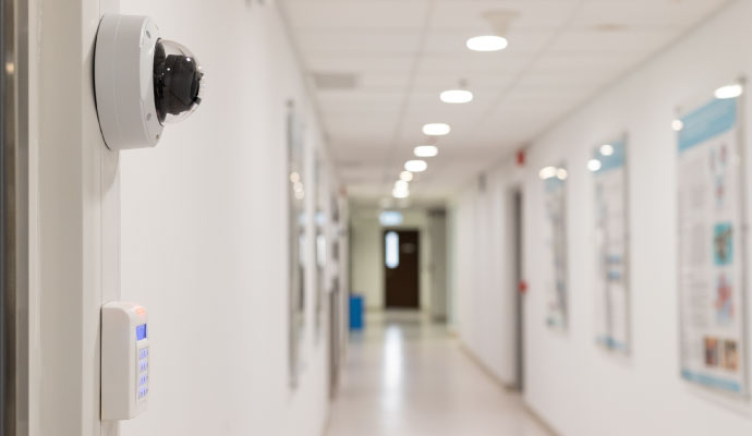 Commercial security camera installed in hallway