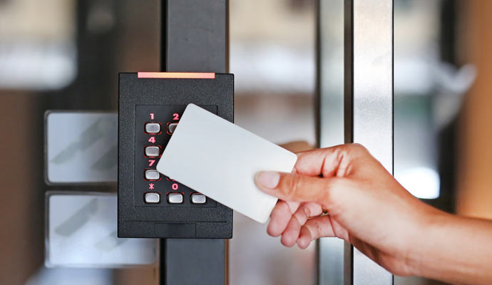 Woman holding key card for door access