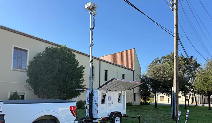 Mobile surveillance trailer with a camera for security.