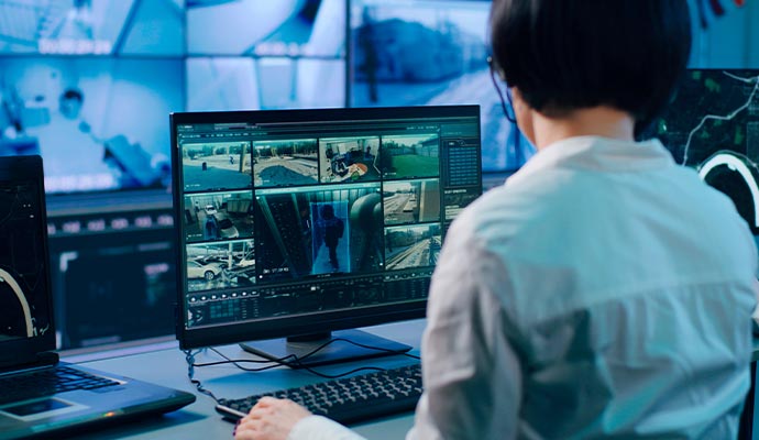 A person monitoring live video footage