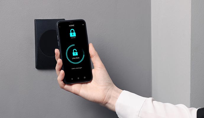 Person using a mobile access control system to unlock a door