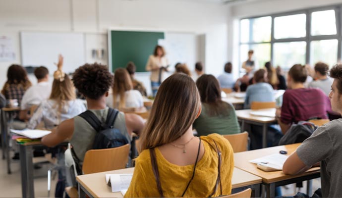 Students attending class in classroom