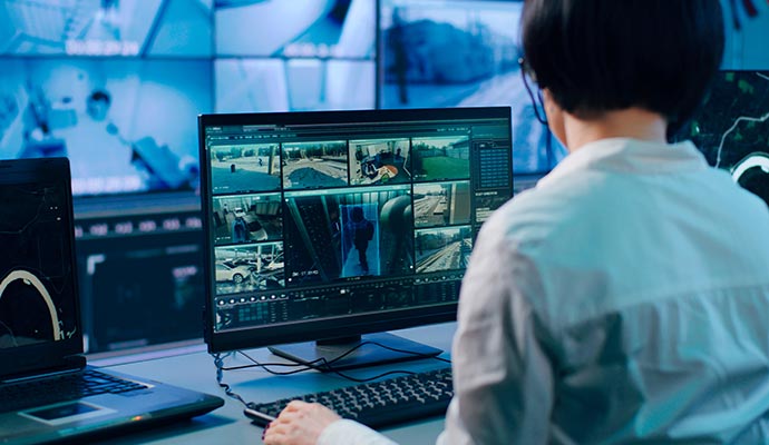 Person monitoring CCTV footage