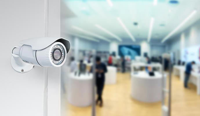 White bullet camera overlooking electronics store